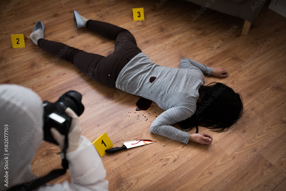 criminalist photographing dead body at crime scene Stock Photo | Adobe Stock