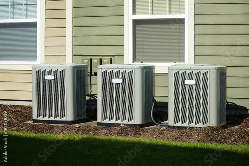 Air conditioner compressors outside the apartment building