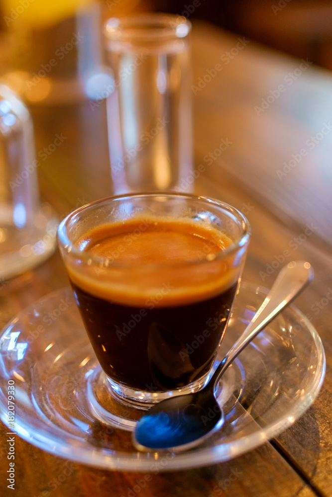 espresso coffee in transparent cup on a wooden table espresso coffee in transparent cup on a wooden table