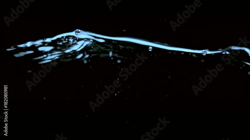 Clear water surface on a black blue ripple