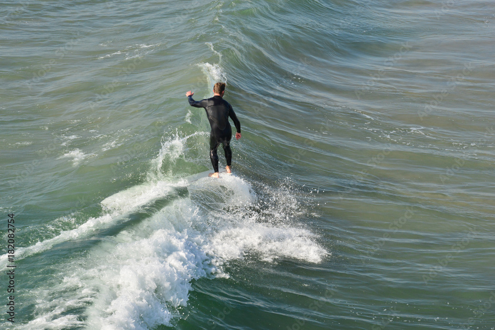 A surfer at Newport Beach, California. A surfer at Newport Beach, California.