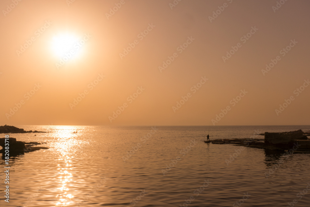 Sunset along the coast of Lebanon with reflection on the ocean