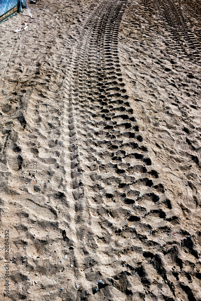 Track of truck wheels on sand Track of truck wheels on sand