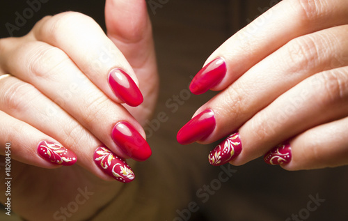 pedicure red in composition with autumn leaves