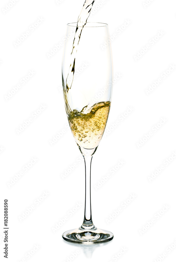 Champagne splash into the glass on white