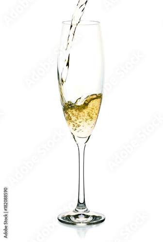 Champagne splash into the glass on white