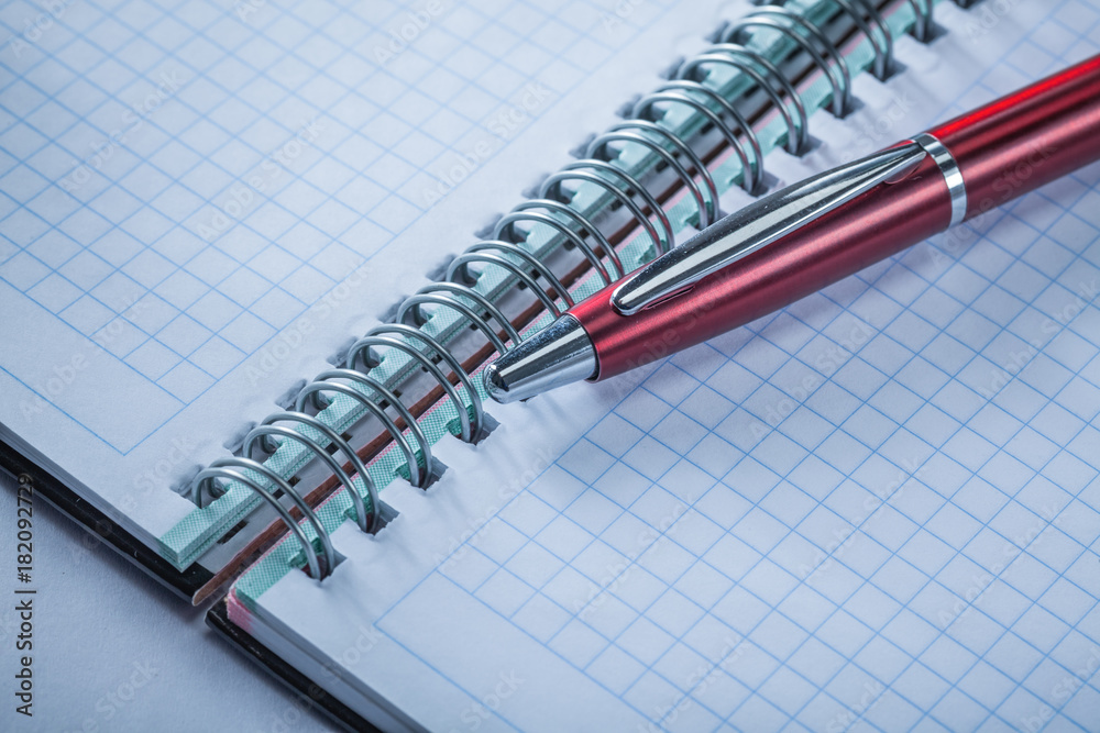 Spiral checked notepad pen top view Spiral checked notepad pen top view