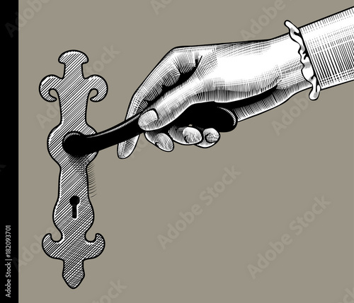 Woman's hand holding door handle