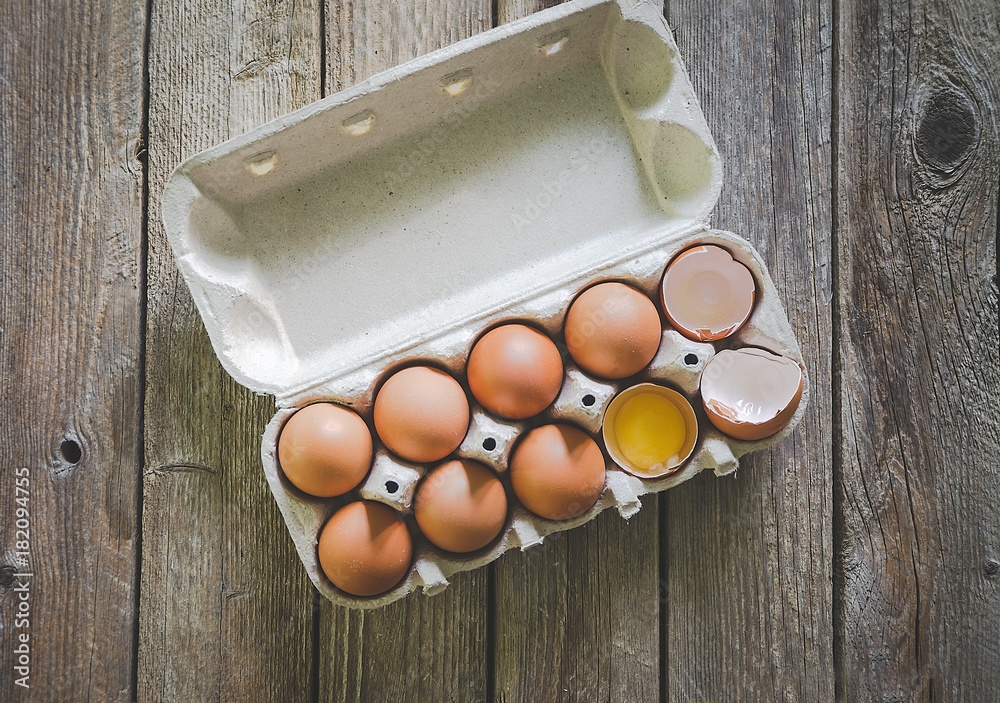 eggs in packing on wooden background eggs in packing on wooden background