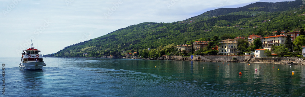 LOVRAN, CROATIA, MAY 01, 2017: The landscape of the coastline built by the old historical town of Lovran on May 1, 2017, Lovran is situated on the western coast of the Kvarner Bay, Croatia