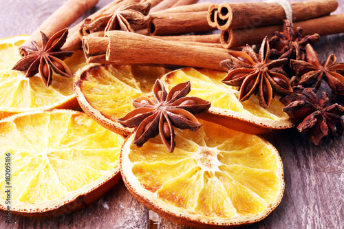 Dry slices of orange, cinnamon, cloves and cardamom.