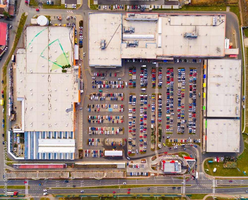Aerial view of parking lot with cars. Industrial background on transportation theme. 