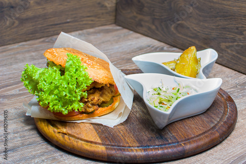 hot burger with sauce on the board