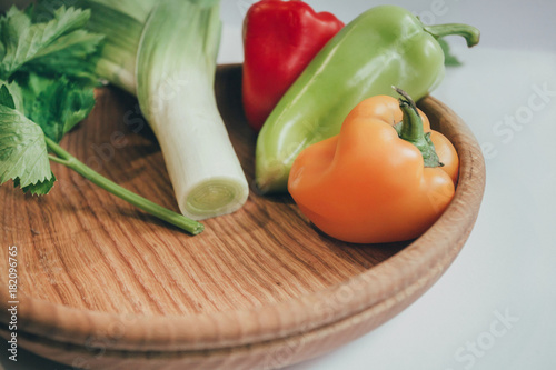 Culinary background with fresh vegetables on cutting board