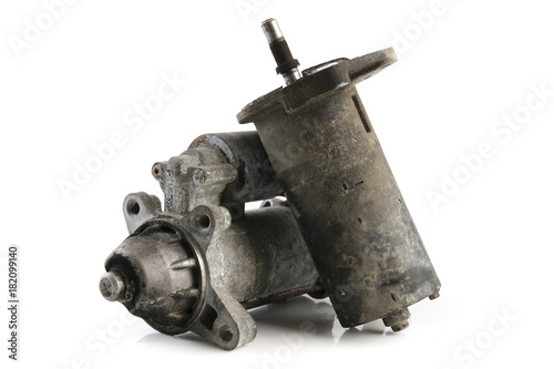 old used engine starter for the car isolated on white background