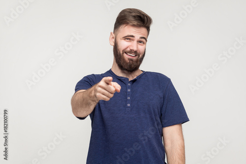 Jibe, bad taunt concept. Young adult man pointing finger