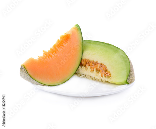 melon slices in white plate isolated on white background