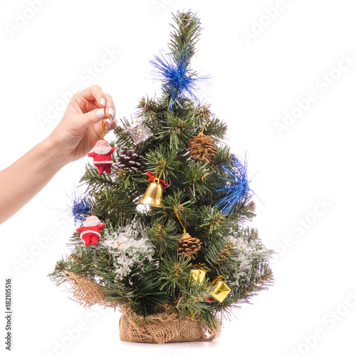 Little Christmas tree toys in a hand