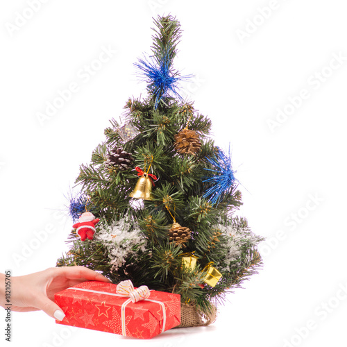Little Christmas tree toys gift presentation in a hand