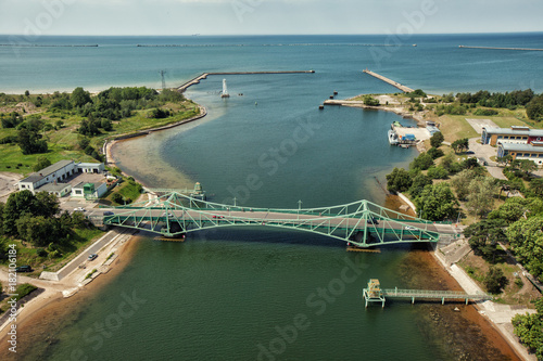 Liepaja city bridge And Blue sea Autumn Drone flight trafics and cars above photo
