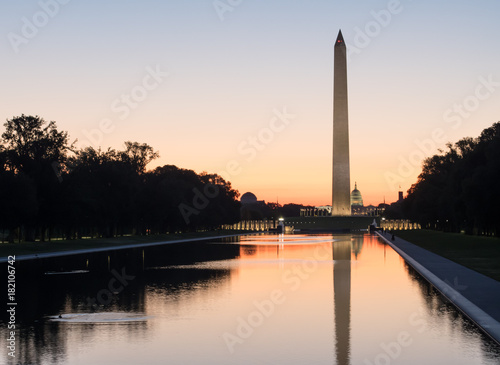 Washington memorial reflection in water at sunrise sunset tranquil in the capital city, Washington DC United States of America U.S. 