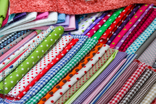 Multicolored textiles on the counter of the store