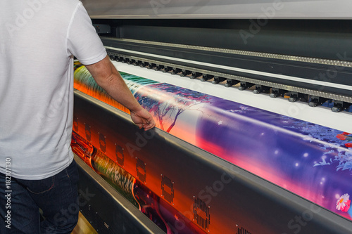 Large-format printing machine in the printing house. Industry photo