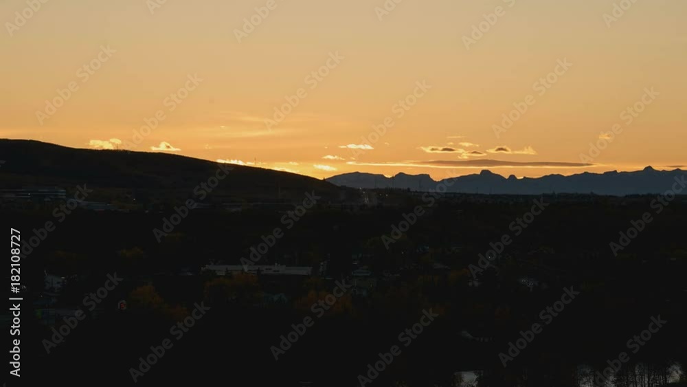 Golden sunset with mountains the background Golden sunset with mountains the background