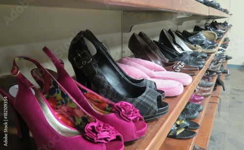 thrift store shoes and odd pink slippers