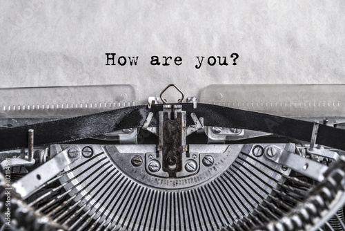 How are you? Printed on an old vintage typewriter. Close-up.