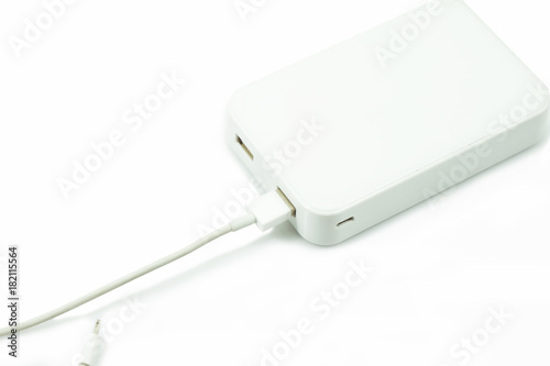 Power bank for charging mobile devices. Isolated over white