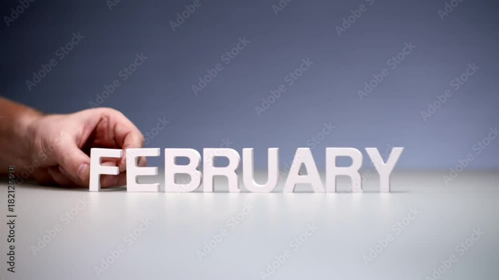 Male hand composition word february. Winter months on calendar and seasons year Male hand composition word february. Winter months on calendar and seasons year