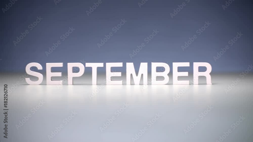 Male hand composition word september. Autumn months on calendar and seasons year Male hand composition word september. Autumn months on calendar and seasons year