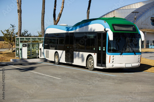 Electric bus stands at the charging station