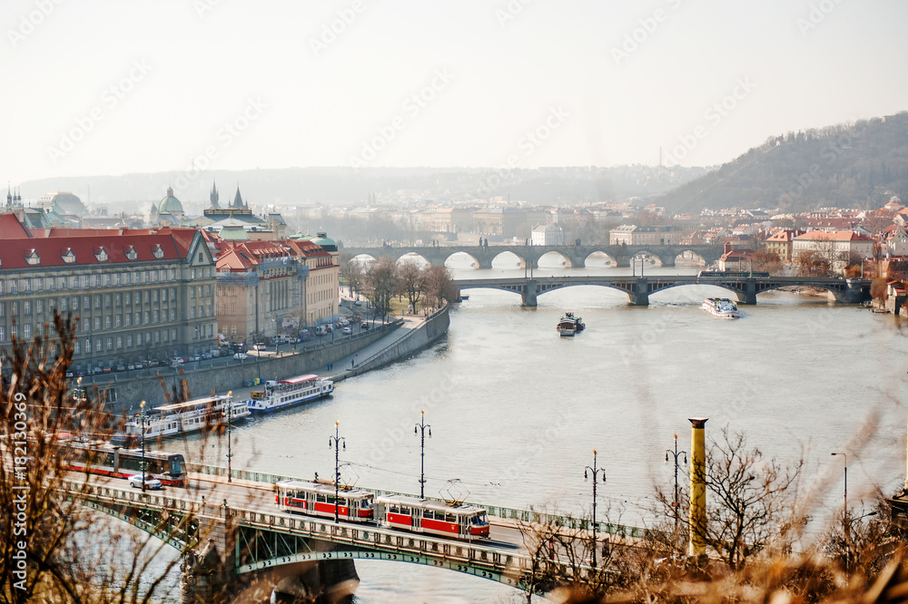 Prague skyline scenic view of the bridges over Vltava river in a foggy day, Czech Republic