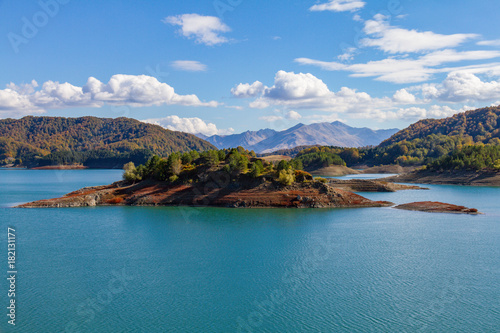 Island on the scenic Aoos artificial lake in Epirus, Greece photo