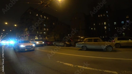     Night traffic on the road at night on Bolshaya Pushkarskaya Street on Petrograd Side in Saint-Petersburg, Russia.  photo