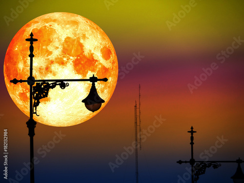 Photography blood moon in color sky and silhouette top of lantern pilla