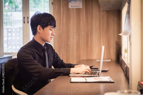 businessman working with labtop or notebook and calculator on the table at office.