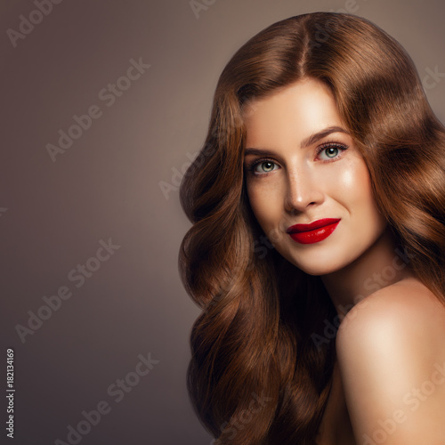 Haircare Concept. Beautiful Woman with Long Healthy Wavy Hairstyle. Girl with Colored Hair, Portrait