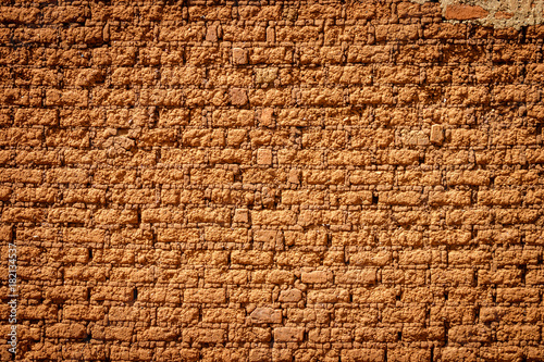 A typical mud brick wall of a house in Uganda. A brick is building material used to make walls, pavements and other elements in masonry construction.