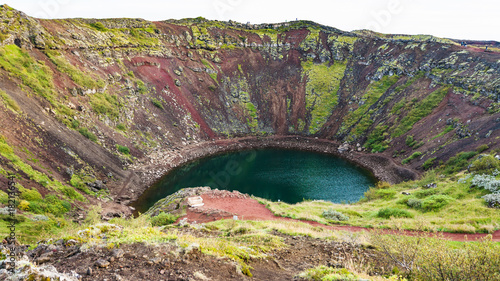 Kerid lake in volcanic crater in september evening photo