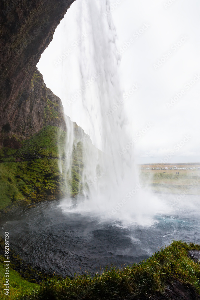 inside view of Seljalandsfoss waterfall in Iceland inside view of Seljalandsfoss waterfall in Iceland