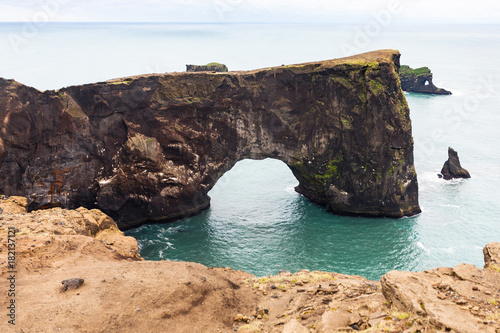 lava arch on Dyrholaey peninsula in Iceland