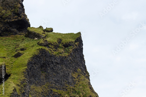 cliff of Reynisfjall mount in Iceland