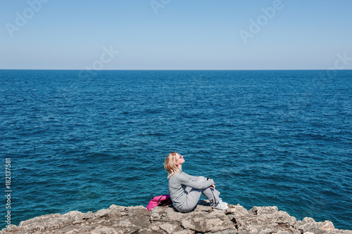 Woman tourist in Polignano, Apulia, Italy, in a summer day © tanialerro
