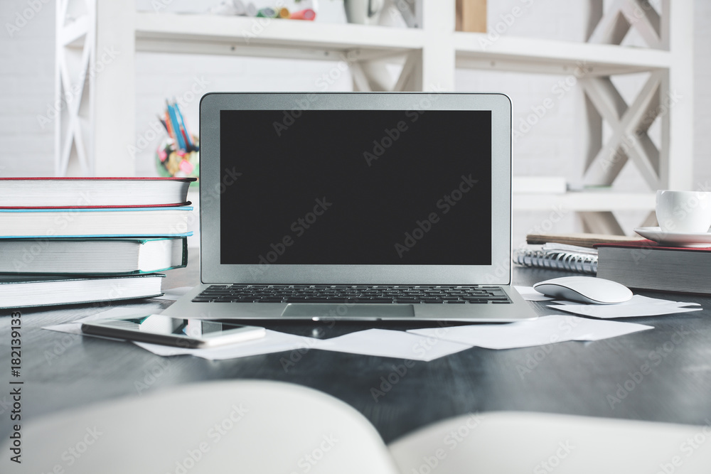 Light office desktop with empty laptop monitor Light office desktop with empty laptop monitor