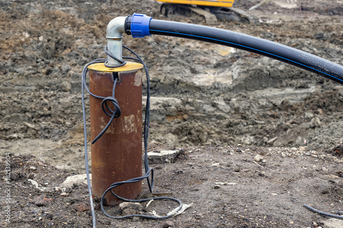 Submersible pump dewater construction site photo