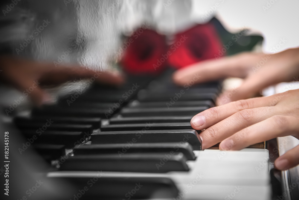 Obraz premium Talented woman playing piano, close up
