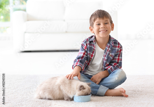 Cute little boy feeding flu...